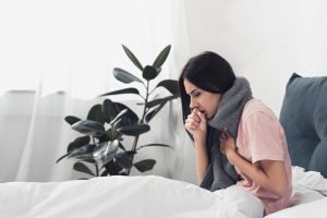 Woman-Coughing-in-Bed