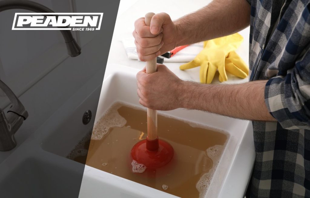 A homeowner struggling with a clogged drain.