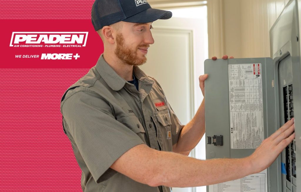 Electrician inspecting a faulty electrical box