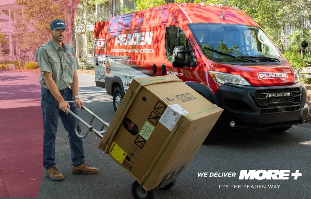 A Peaden HVAC tech delivering a new AC condenser unit.