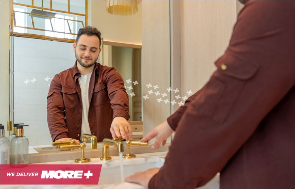 A man admiring his newly installed plumbing fixture
