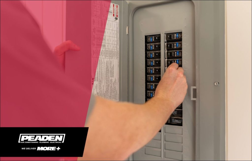 Electrician inspecting an electrical panel.