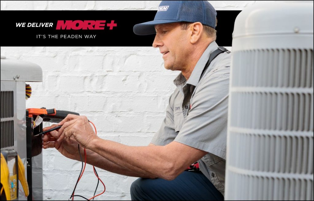 HVAC technician performing winter maintenance