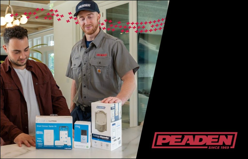 An HVAC technician showing a homeowner smart devices for his home