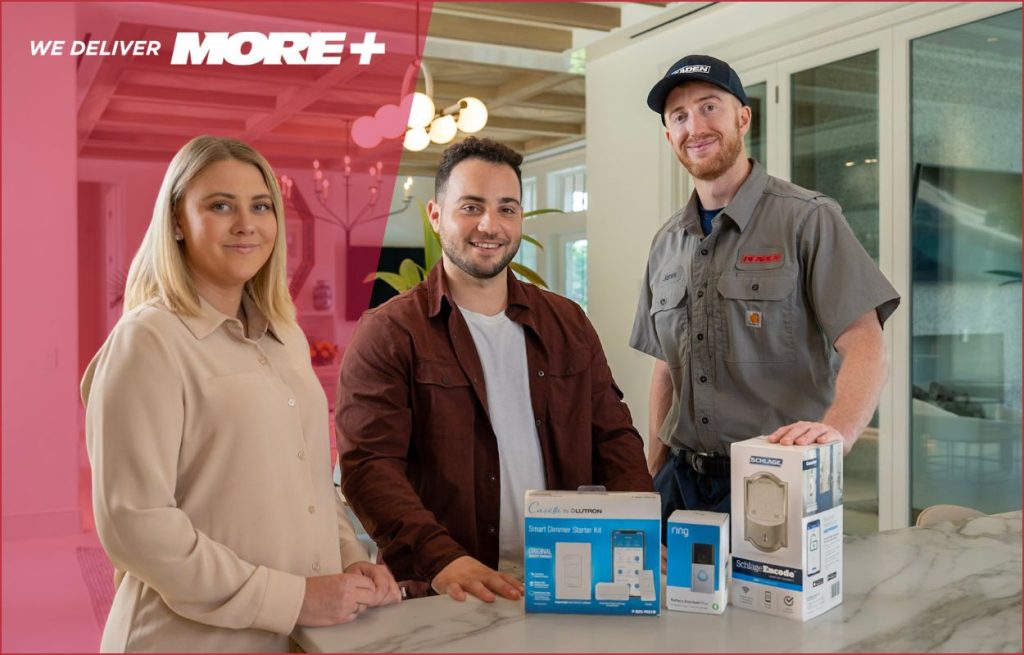 An HVAC technician discussing smart devices and smart thermostats with the homeowners