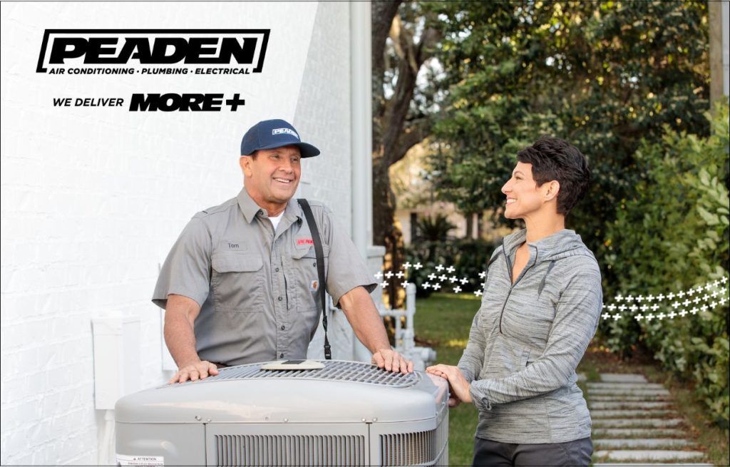 A Peaden HVAC tech doing AC maintenance.