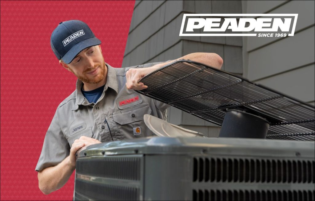 A Peaden HVAC tech working on a heat pump.
