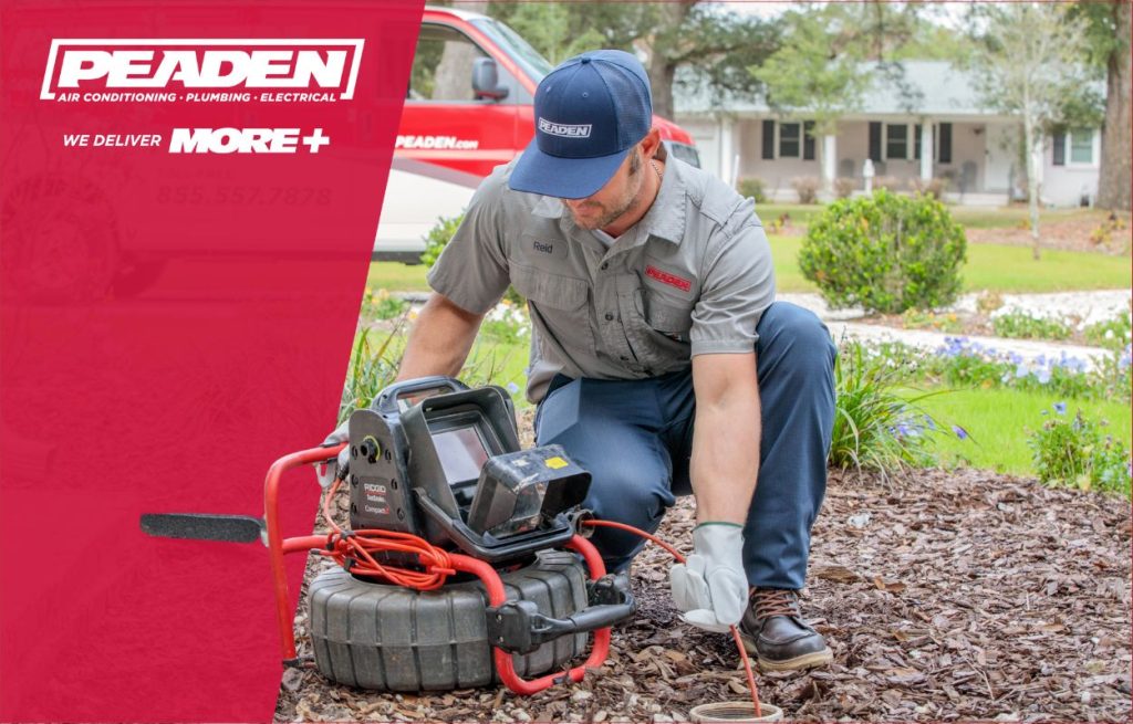 A Peaden plumber using a drain camera.