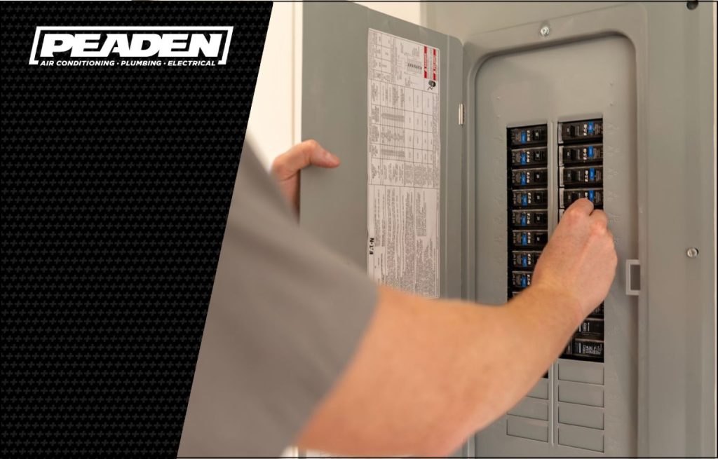 A Peaden Electrician working on a electrical box.