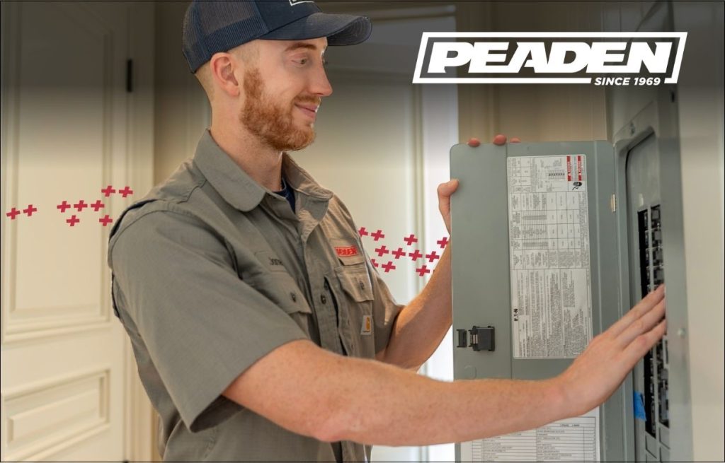A Peaden Electrician working on a electrical box.
