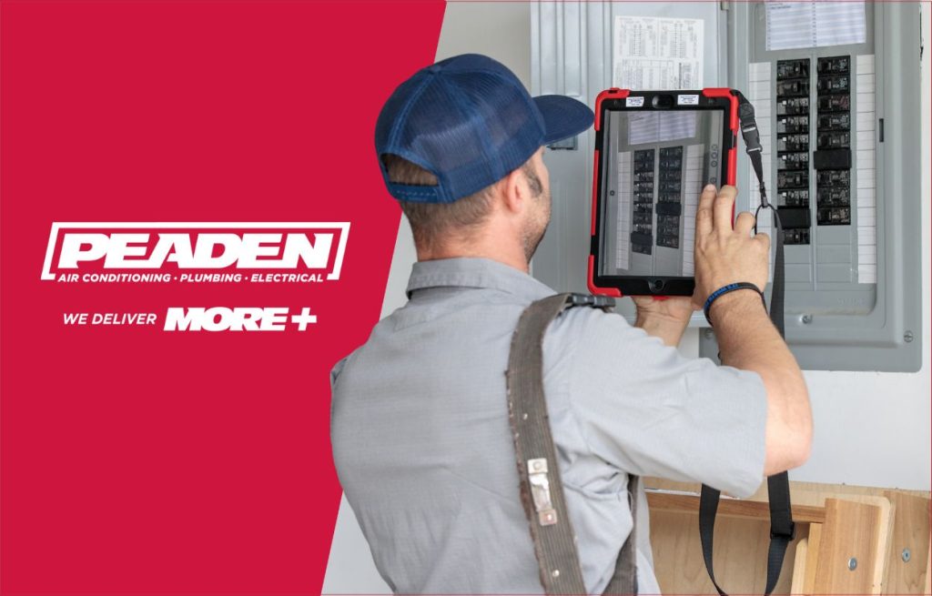 A Peaden HVAC tech working on a electrical panel