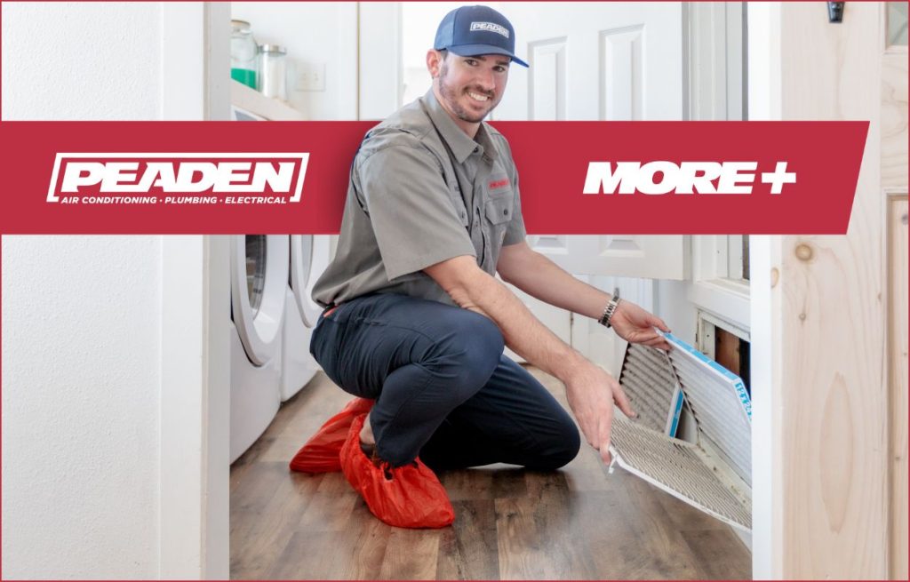 A Peaden HVAC tech changing an air filter