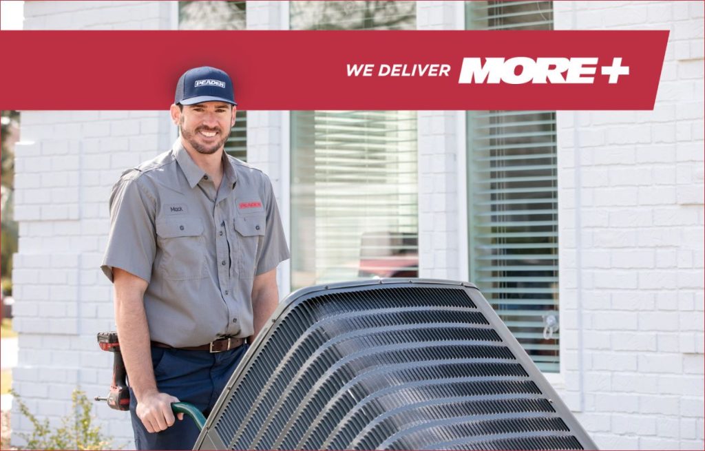 A Peaden HVAC tech delivering a heat pump.