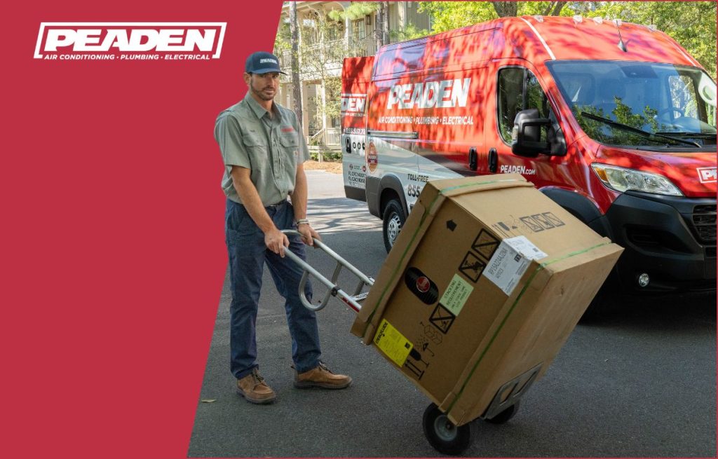 A Peaden HVAC tech delivering a new heat pump.