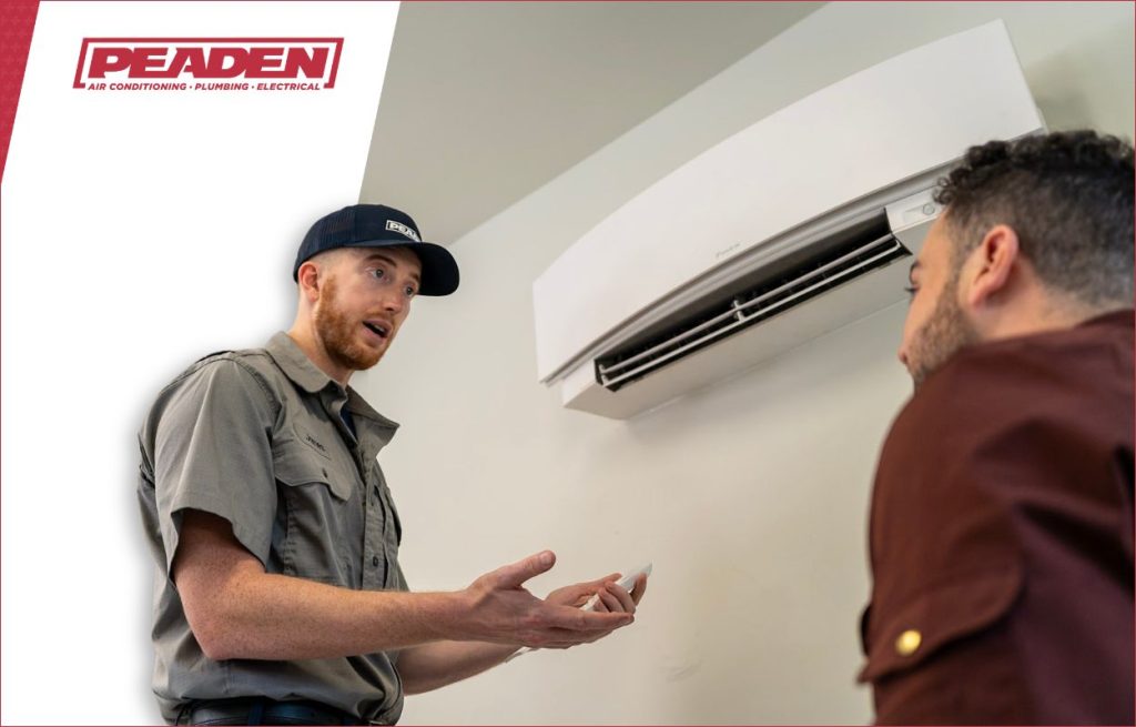 A Peaden HVAC tech discussing a minisplit