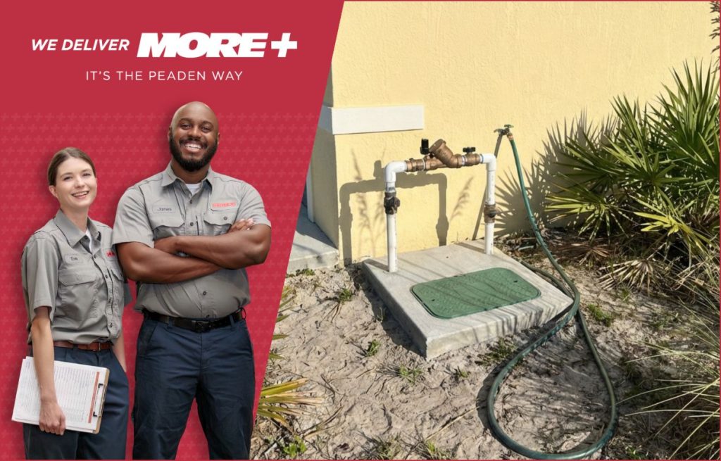Two Peaden techs in front of a backflow valve.