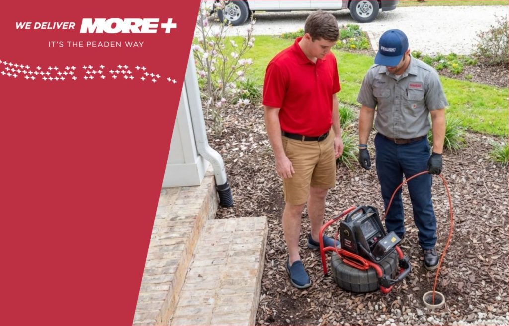 A Peaden plumber using a drain camera.