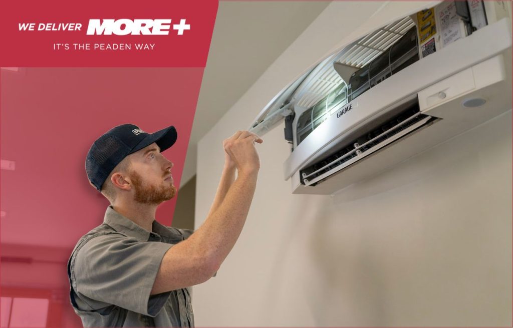 A Peaden HVAC tech installing a new minisplit unit.