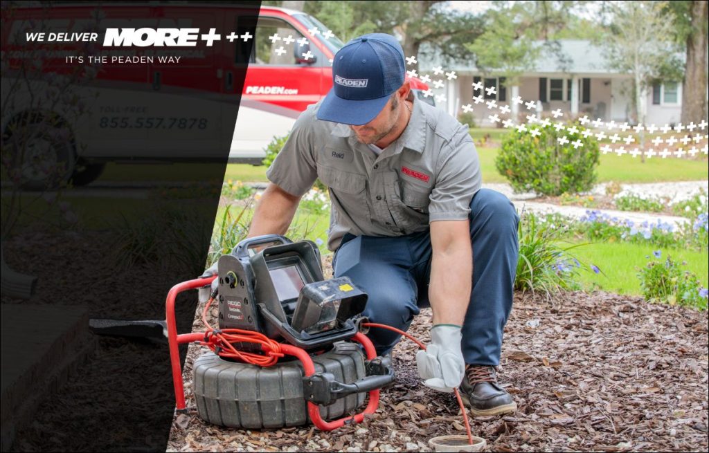 A Peaden plumber using a drain camera.