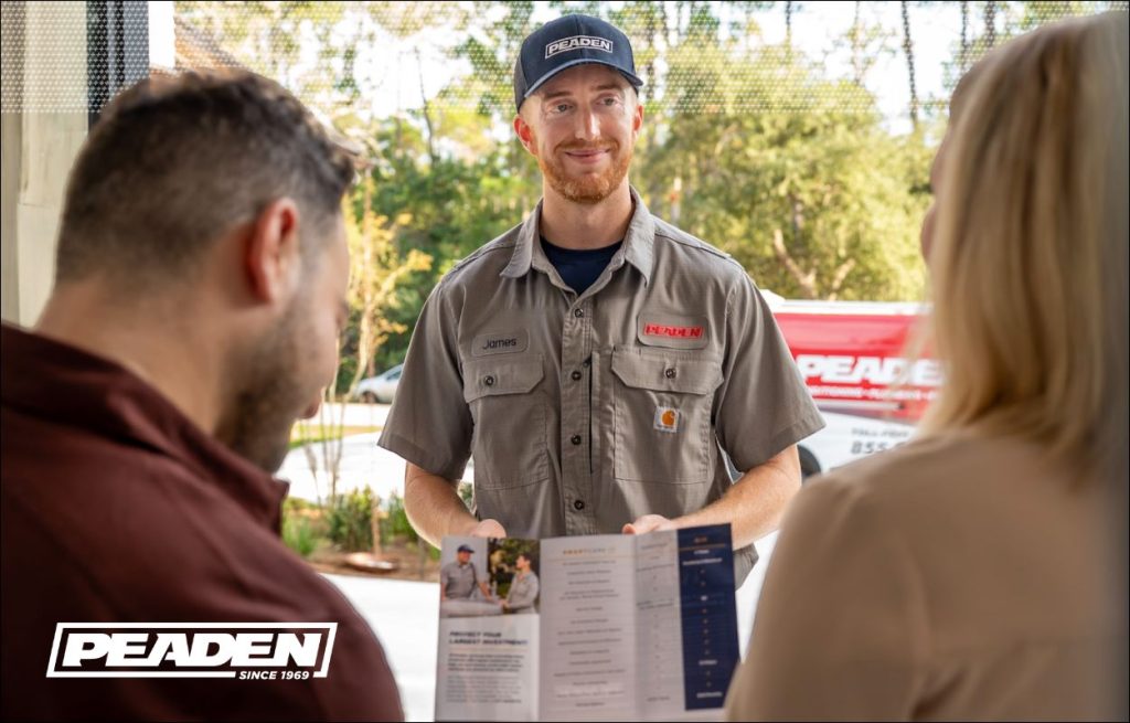 A Peaden HVAC tech explaining the benefits of a new heat pump