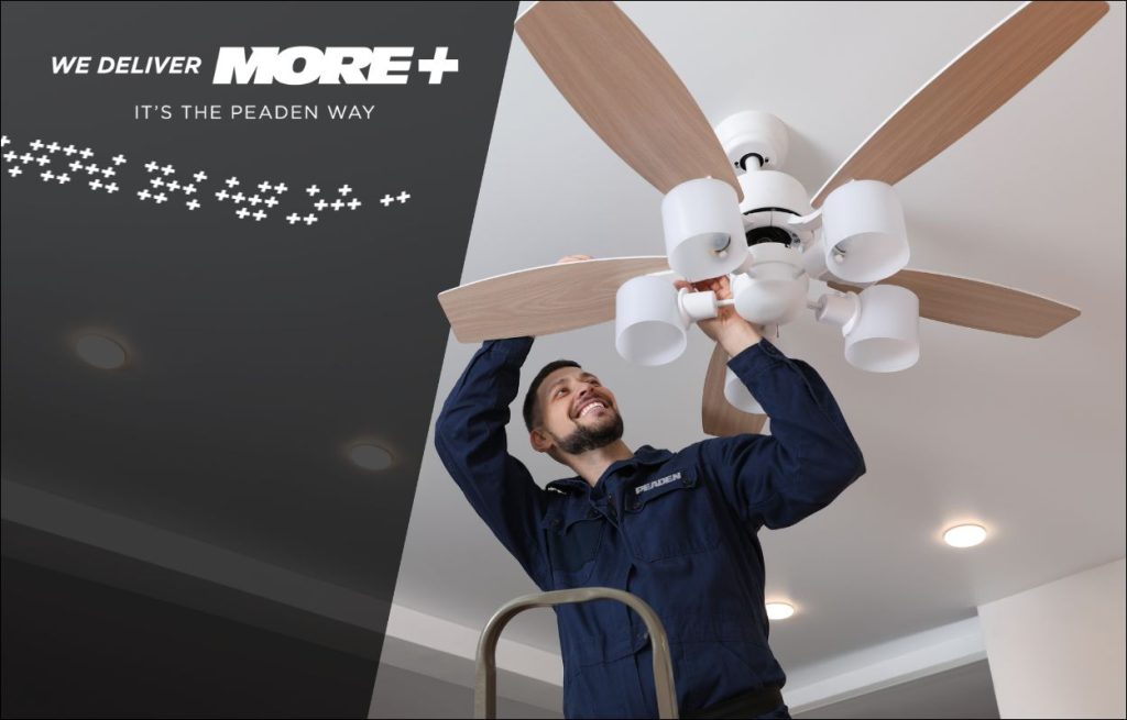 A Peaden Electrician installing a ceiling fan.