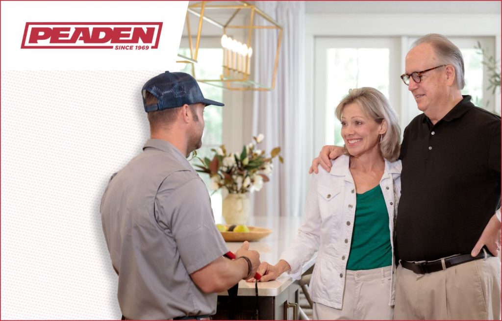 An HVAC tech discussing attic fan installation.