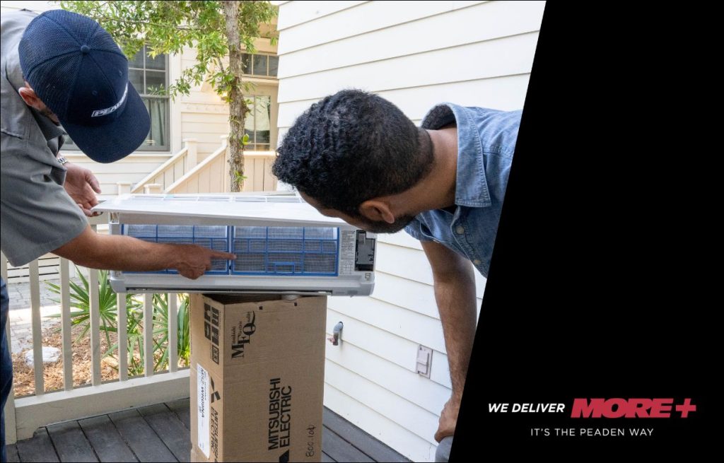 A Peaden HVAC tech discussing a new mini split.