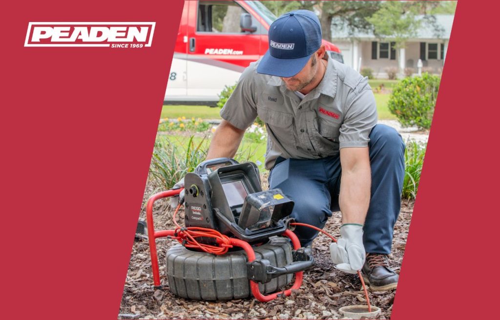 A Peaden plumber using a drain camera.