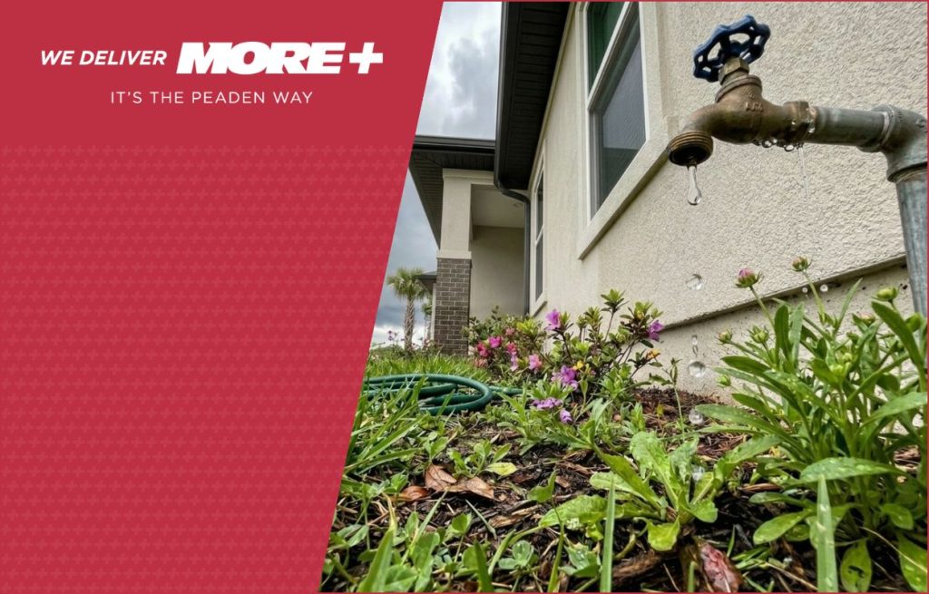A leaking faucet on the side of a home.