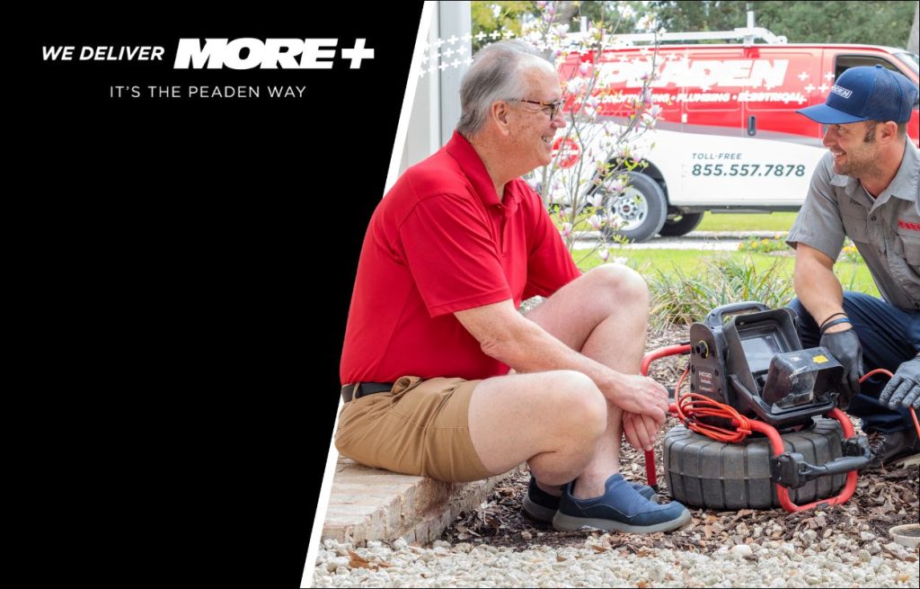 A Peaden plumber using a drain camera.