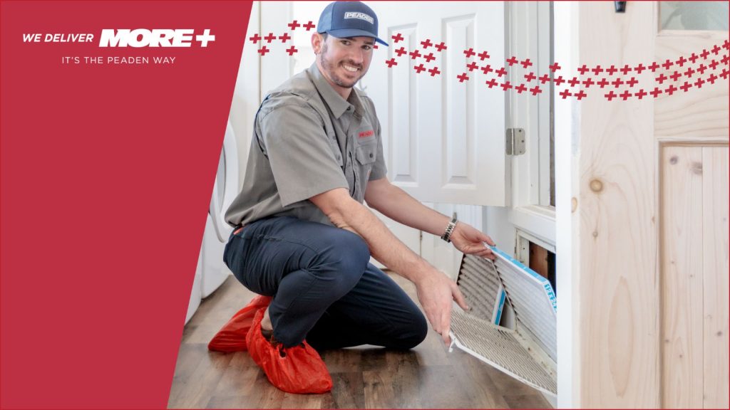 A Peaden HVAC tech changing an air filter