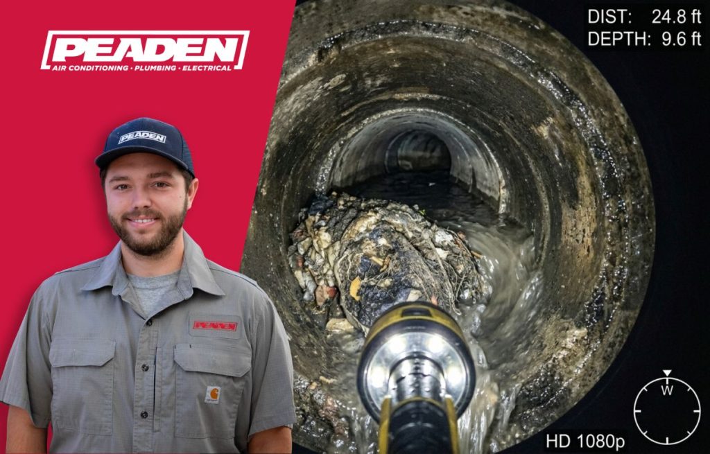 A Peaden plumber using a drain camera.