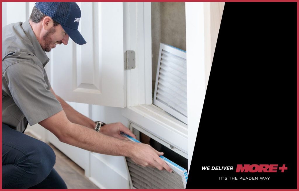 A Peaden HVAC tech changing an air filter