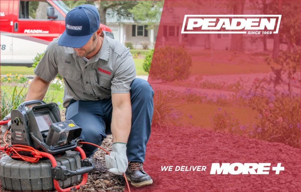 A Peaden plumber using a drain camera.