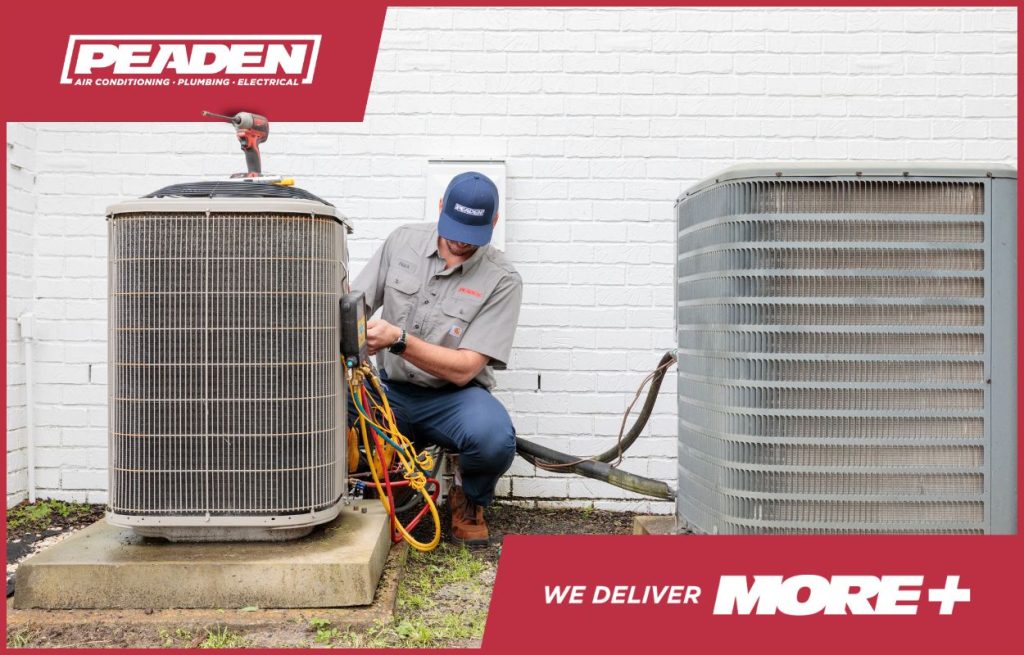 A Peaden HVAC tech adjusting a AC unit.