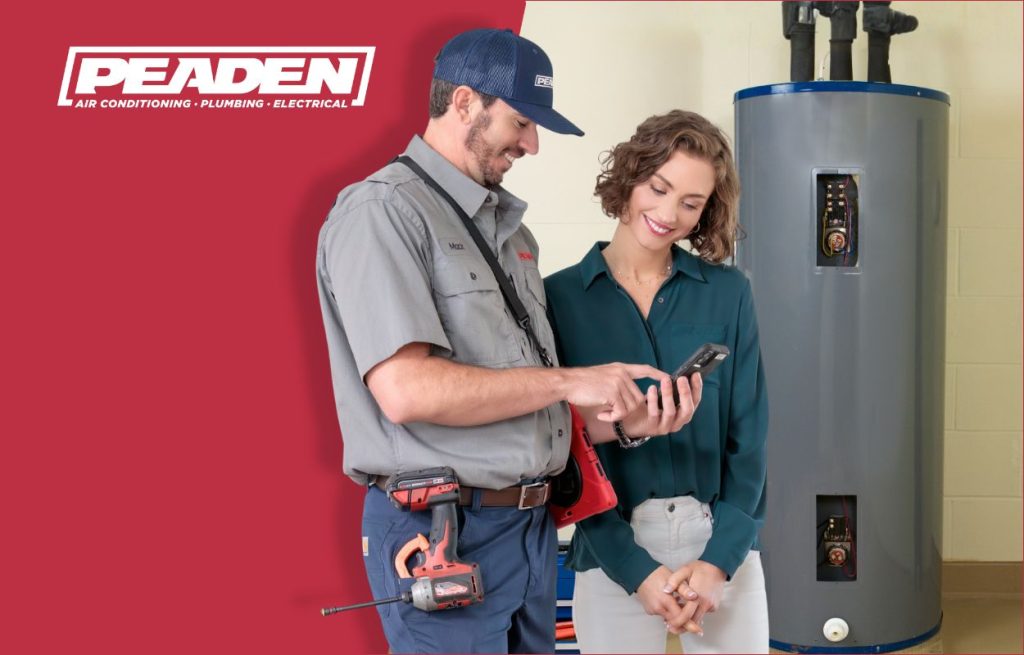 A Peaden plumber discussing water heaters with a homeowner.