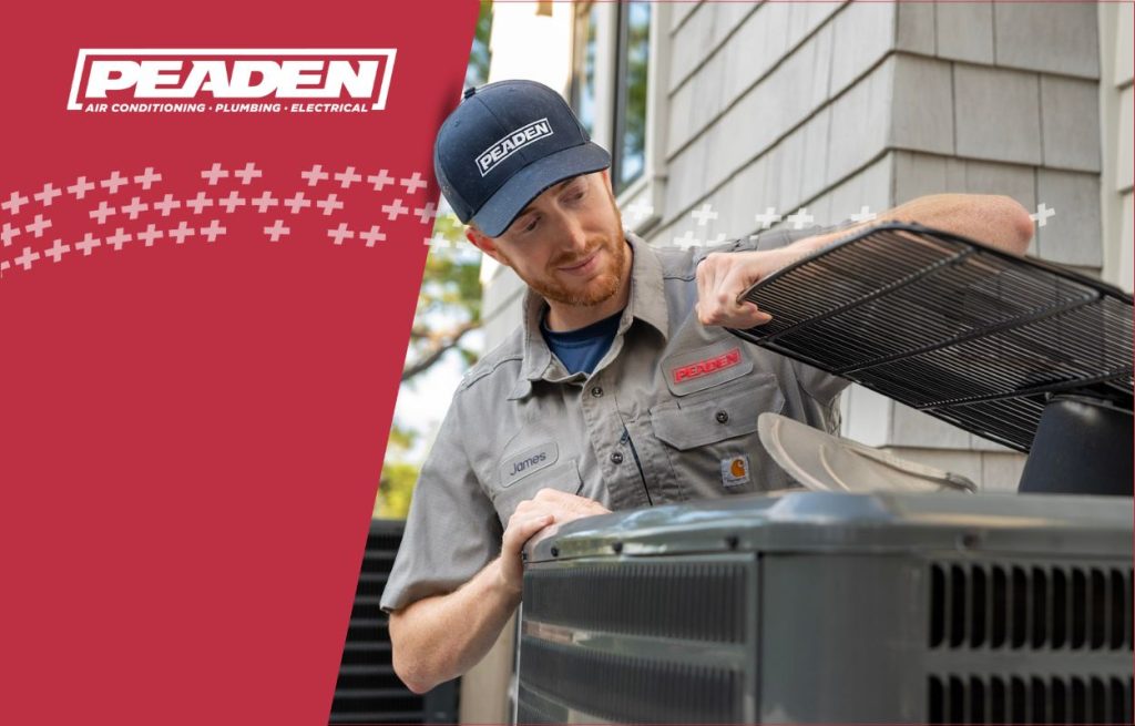 A Peaden HVAC tech working on a AC unit.