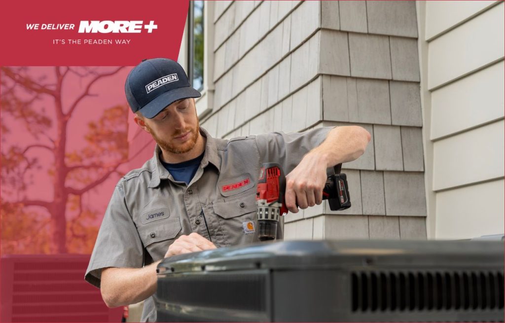 A Peaden HVAC tech working on a AC unit.