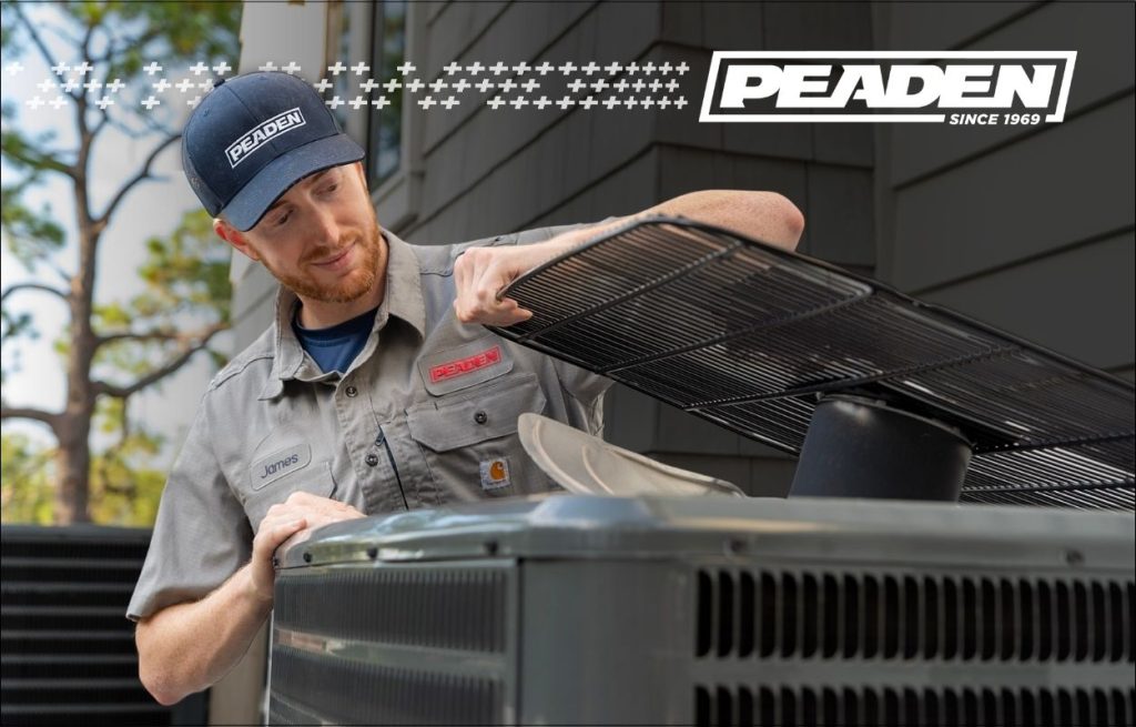 A Peaden HVAC tech working on a AC UNIT