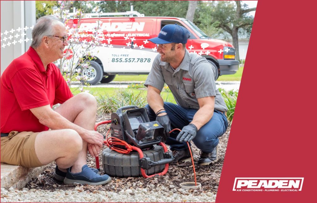 A Peaden plumber using a drain camera.