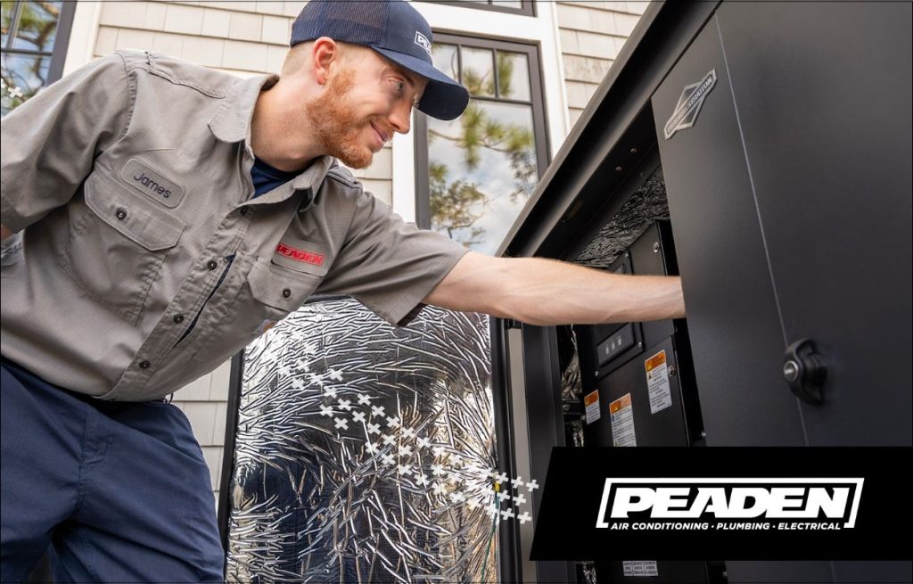 A Peaden Electrician working on a generator