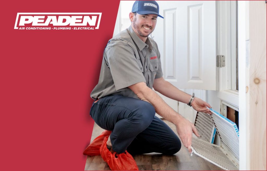 A Peaden HVAC tech changing an air filter