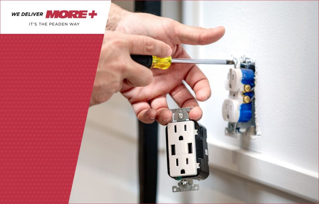 A Peaden Electrician working on a outlet