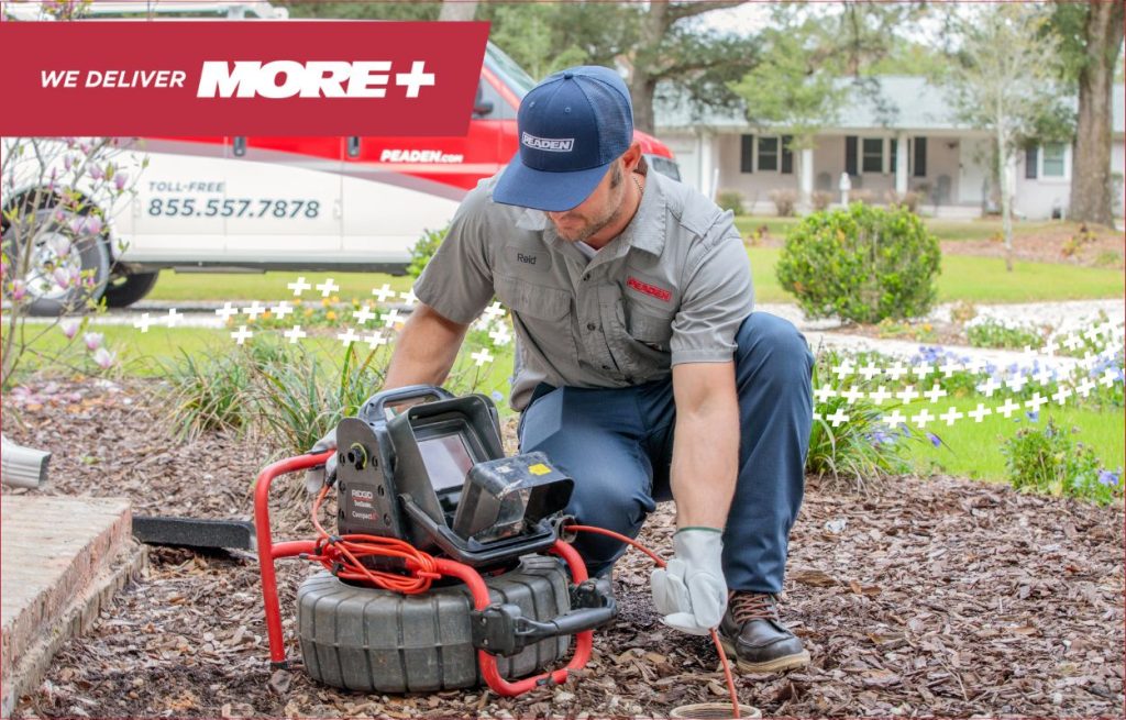 A Peaden plumber using a drain camera.