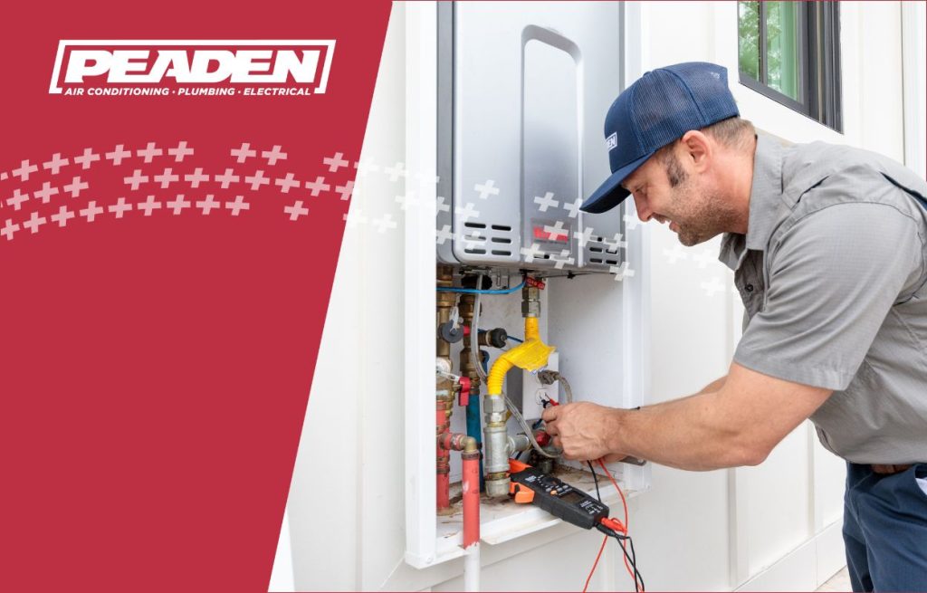 A Peaden plumber installing a tankless water heater.