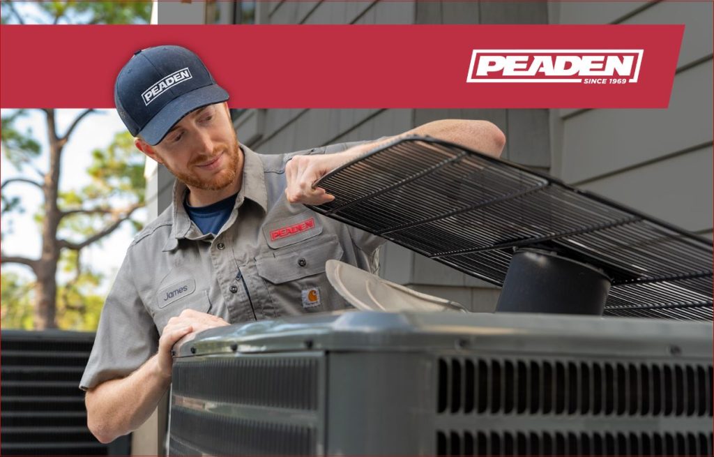 A Peaden HVAC tech working on a AC unit