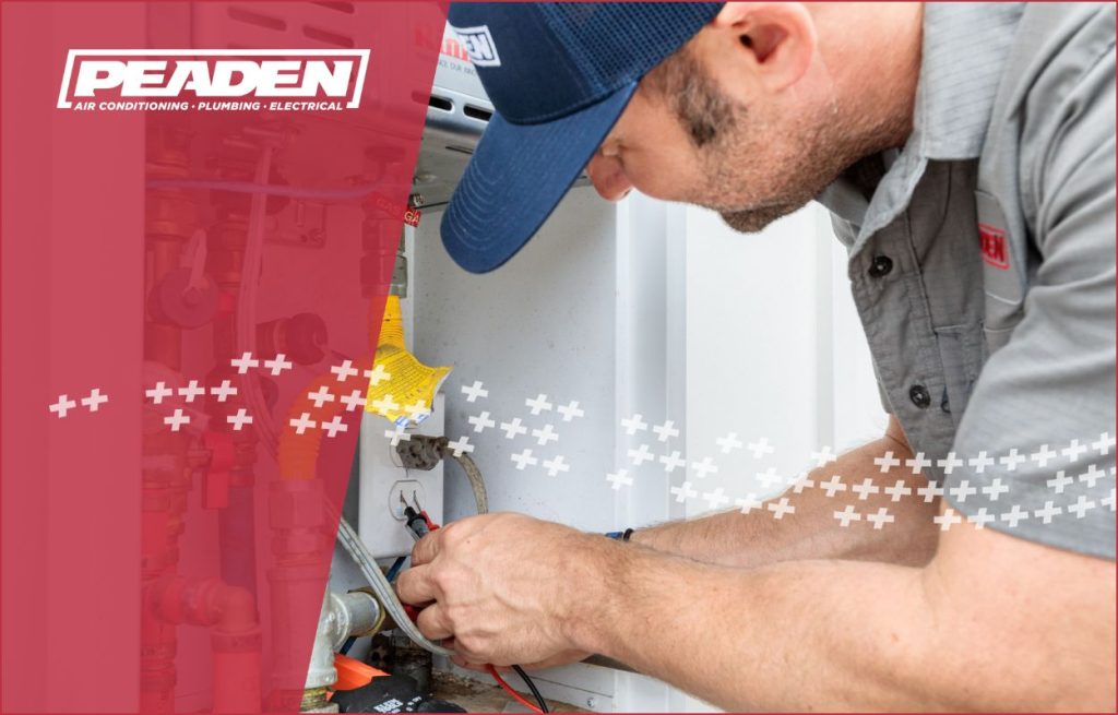A Peaden plumber installing a tankless water heater.