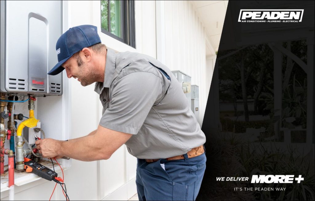 A Peaden plumber installing a tankless water heater.