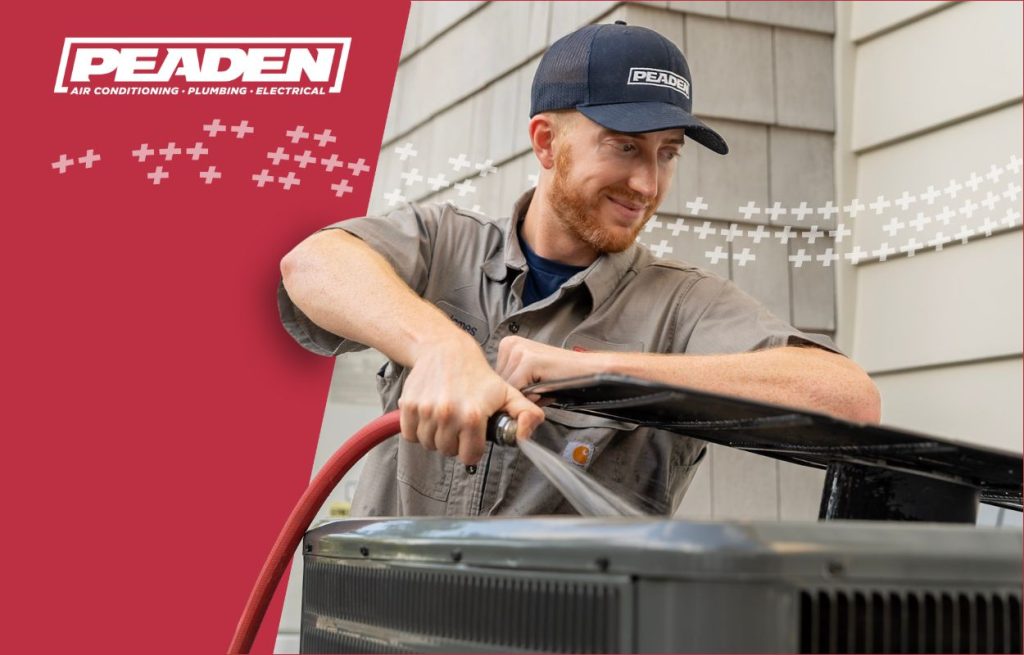 A Peaden HVAC tech working on an AC Unit.