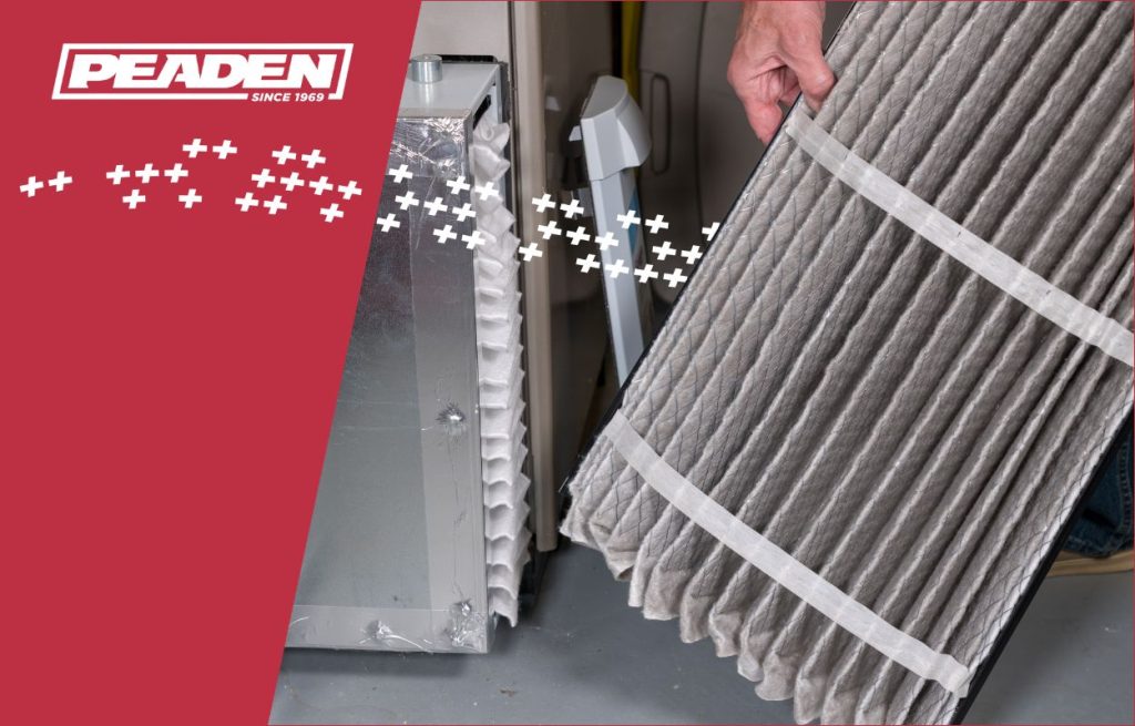 A Peaden HVAC tech changing an air filter